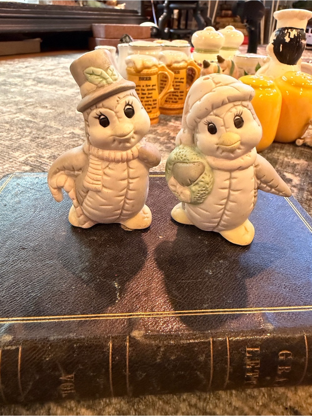 Vintage porcelain penguin salt and pepper shakers.